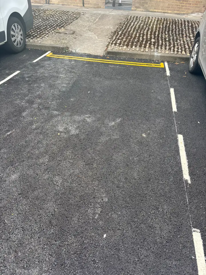 Parking space after the pictured waste was removed.