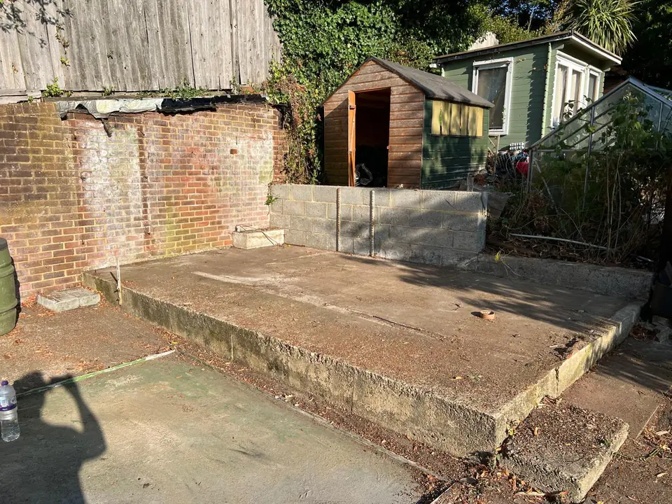 Exposed concrete base after removal of the pictured structure.